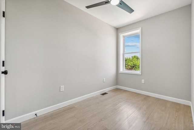 empty room featuring ceiling fan and light wood-type flooring