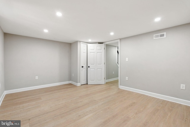 basement featuring light hardwood / wood-style flooring