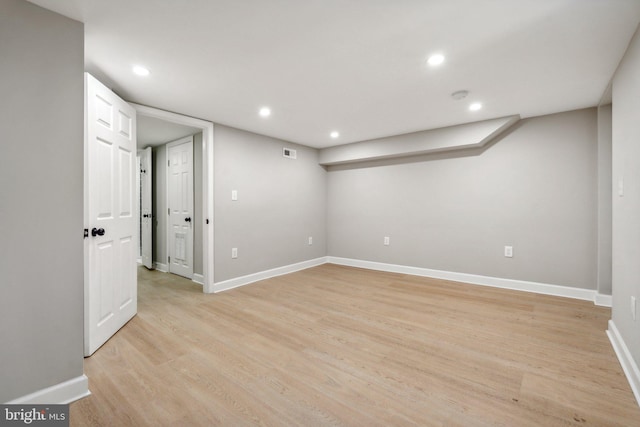 basement featuring light hardwood / wood-style flooring