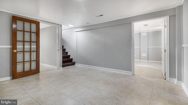 basement with light tile patterned flooring