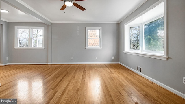 empty room with crown molding, ceiling fan, and light hardwood / wood-style flooring