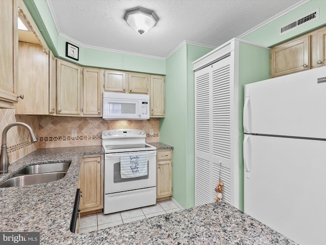 kitchen featuring sink, light tile patterned floors, ornamental molding, white appliances, and decorative backsplash