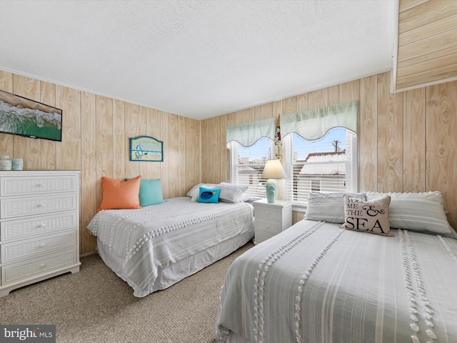 bedroom featuring carpet floors and a textured ceiling