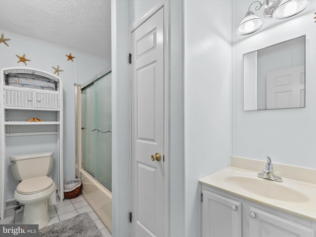 full bathroom with combined bath / shower with glass door, vanity, toilet, tile patterned floors, and a textured ceiling