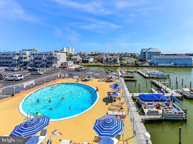 view of pool featuring a water view