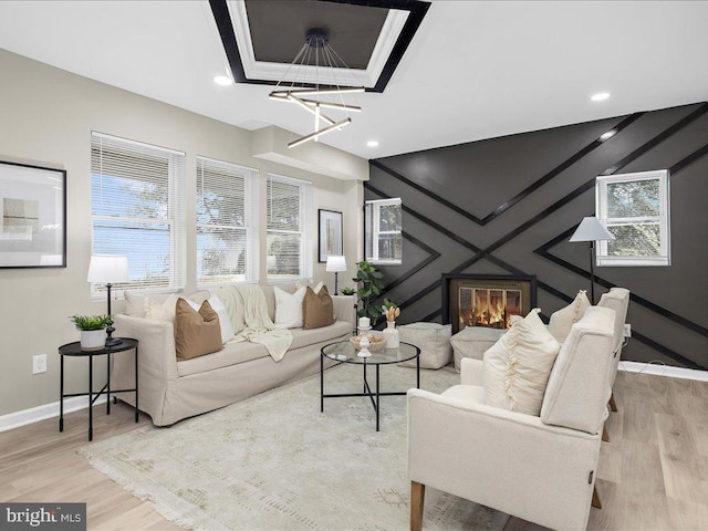 living room featuring light hardwood / wood-style flooring and a healthy amount of sunlight