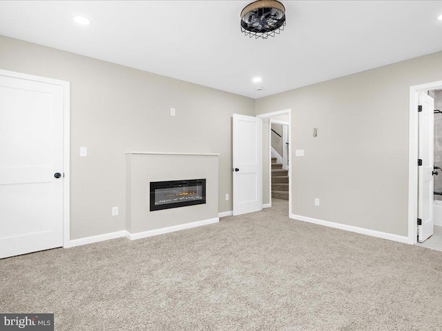 unfurnished living room with light carpet