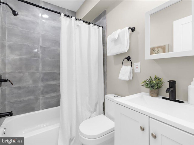 full bathroom featuring vanity, shower / bath combo with shower curtain, and toilet