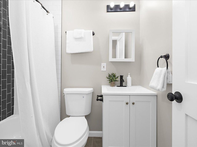 full bathroom with vanity, toilet, and shower / tub combo