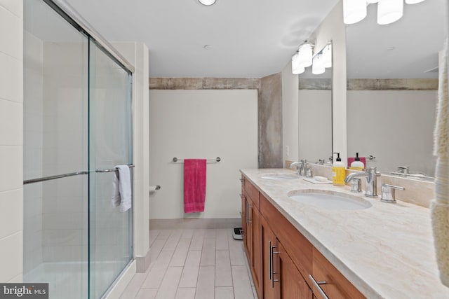 bathroom featuring vanity and an enclosed shower