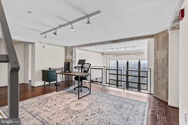 office with dark wood-type flooring and rail lighting