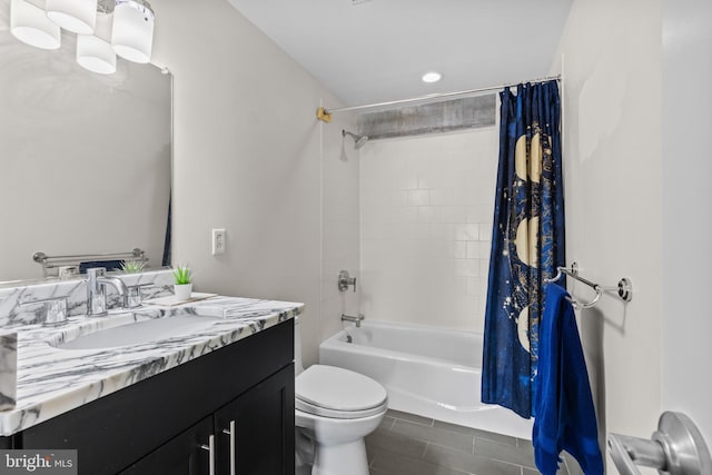 full bathroom featuring vanity, shower / bath combo, and toilet