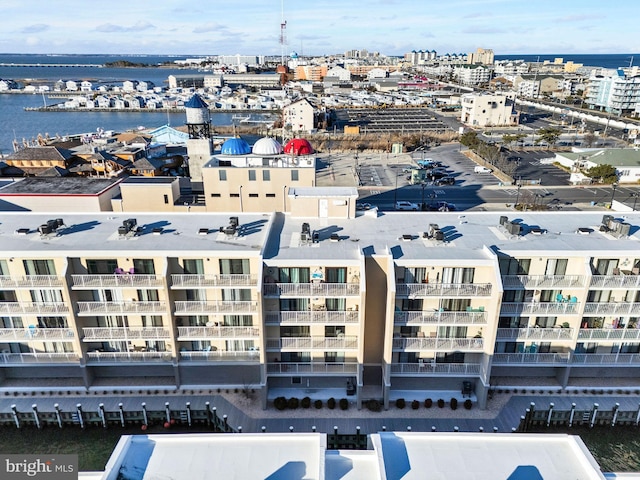 birds eye view of property with a water view