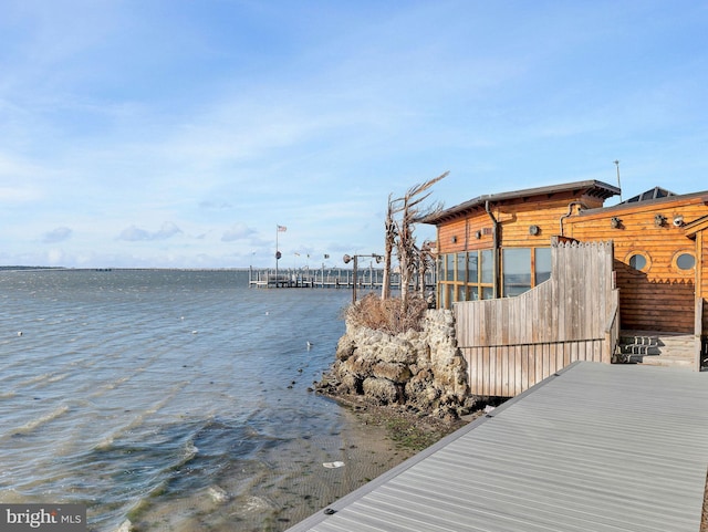 dock area with a water view