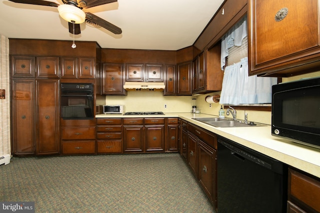 kitchen featuring ceiling fan, dark brown cabinetry, sink, and black appliances