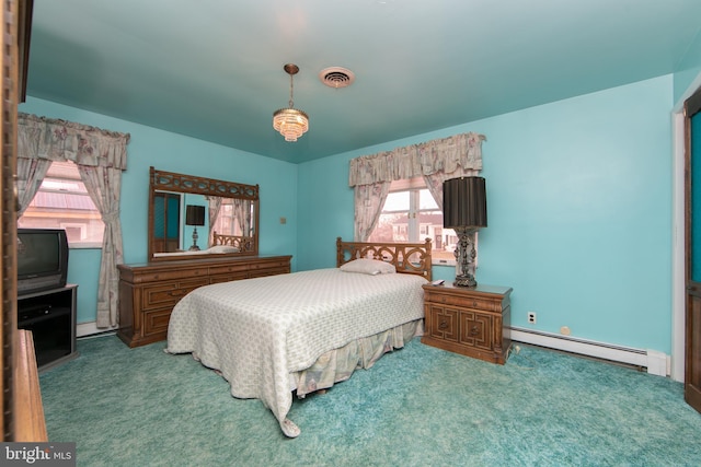 bedroom featuring carpet floors and a baseboard heating unit