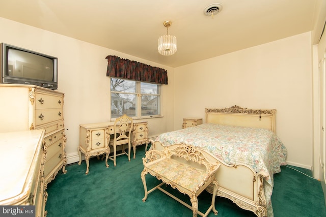 carpeted bedroom with a chandelier