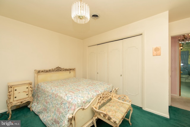 bedroom with a closet and dark colored carpet