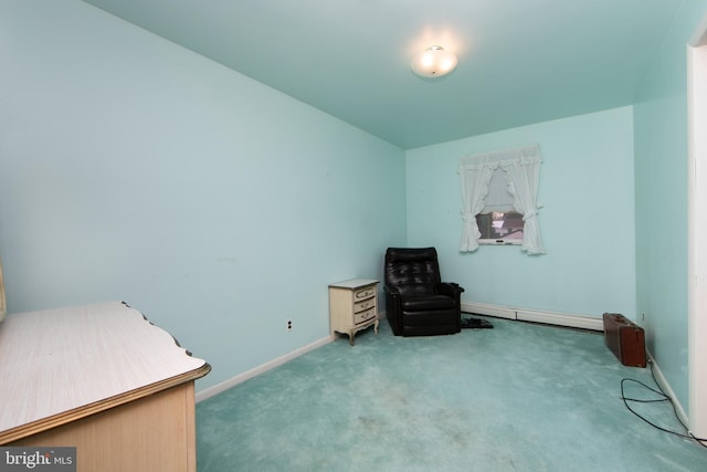 sitting room with carpet and a baseboard heating unit