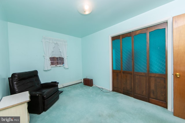 living area featuring a baseboard radiator and light colored carpet