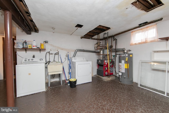 interior space with water heater, separate washer and dryer, sink, and a textured ceiling