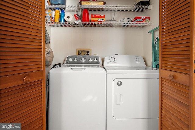 clothes washing area with laundry area and washing machine and clothes dryer