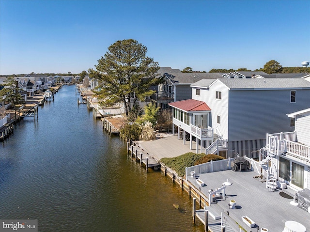 exterior space featuring a water view and a residential view