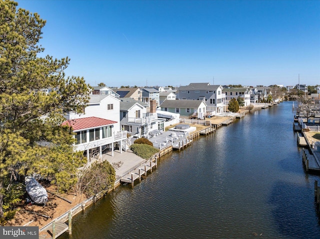 aerial view with a residential view and a water view