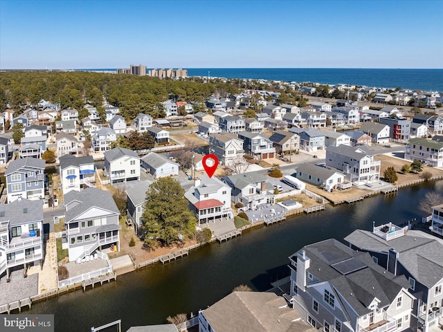 bird's eye view featuring a residential view and a water view