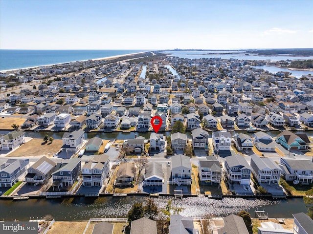 aerial view featuring a residential view and a water view