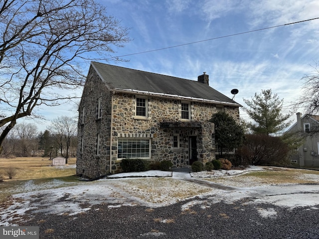 view of front of property with a storage unit