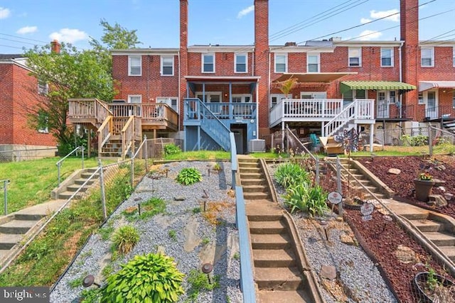 back of property with central AC unit