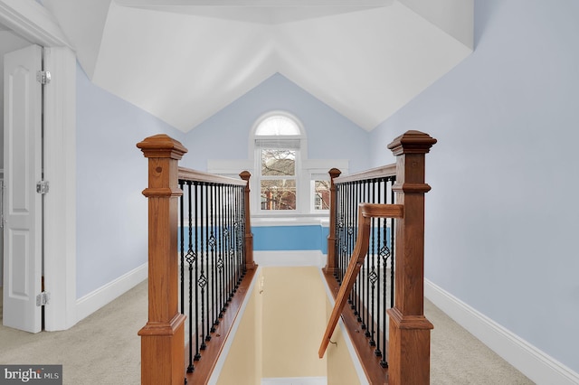 stairs featuring vaulted ceiling and carpet floors