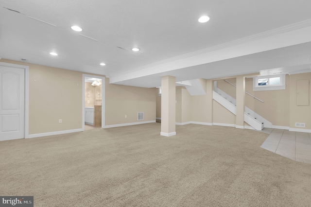 basement featuring light colored carpet