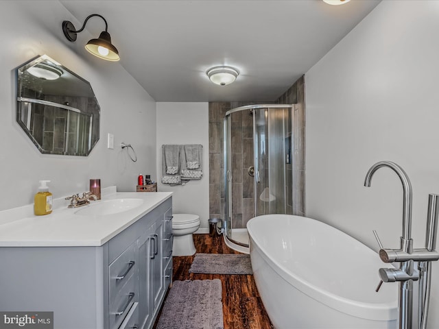 full bathroom with vanity, toilet, independent shower and bath, and hardwood / wood-style floors