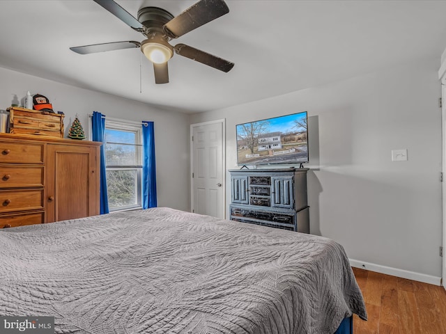 bedroom featuring ceiling fan and hardwood / wood-style floors