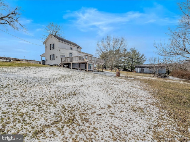 back of property with a wooden deck