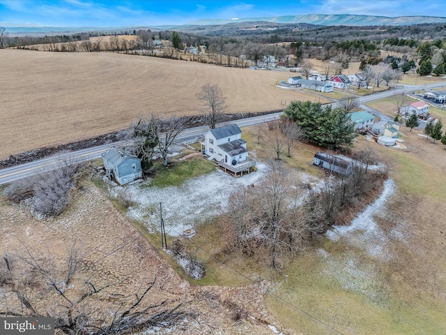 birds eye view of property featuring a mountain view