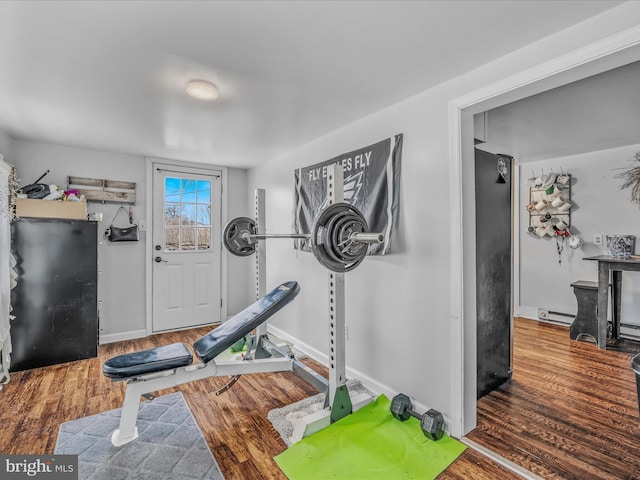 exercise area featuring wood-type flooring