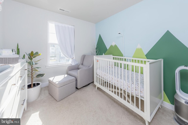 carpeted bedroom featuring a crib