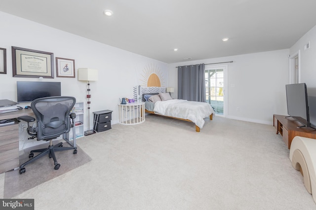 carpeted bedroom featuring access to exterior