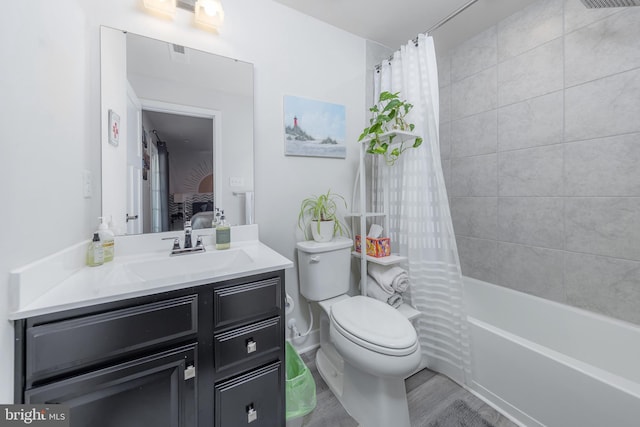 full bathroom featuring vanity, shower / bath combination with curtain, and toilet