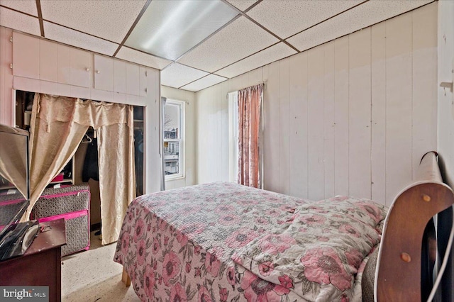 bedroom with a paneled ceiling