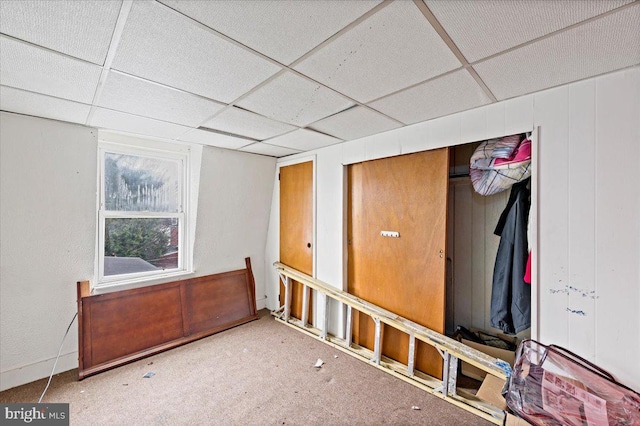 interior space featuring a drop ceiling
