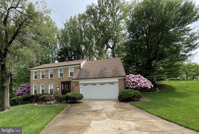 11919 Berrybrook Ter, Upper Marlboro, MD 20772 - colonial house featuring brick siding, a garage, driveway, a front yard, and a chimney