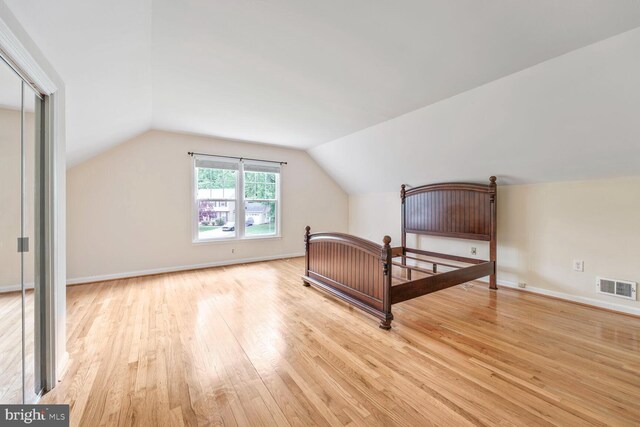 11919 Berrybrook Ter, Upper Marlboro, MD 20772 - bedroom with light wood finished floors and vaulted ceiling