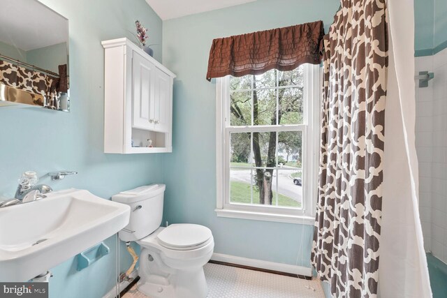 11919 Berrybrook Ter, Upper Marlboro, MD 20772 - bathroom with plenty of natural light, toilet, a sink, and a shower with shower curtain