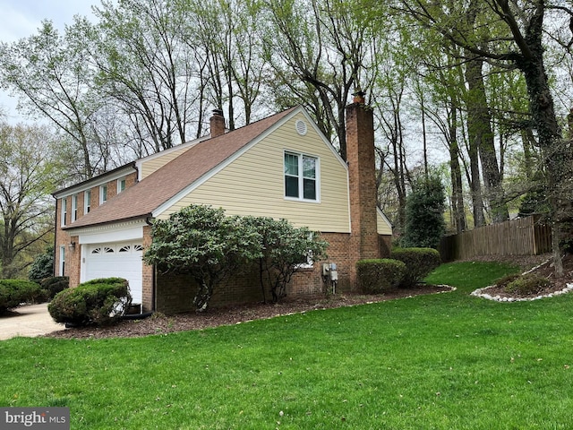 11919 Berrybrook Ter, Upper Marlboro, MD 20772 - view of property exterior with a chimney, brick siding, an attached garage, and a shingled roof