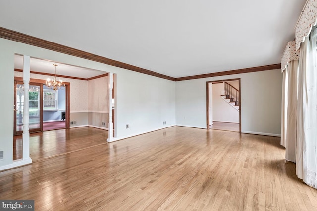 11919 Berrybrook Ter, Upper Marlboro, MD 20772 - unfurnished living room featuring a chandelier, stairs, wood finished floors, crown molding, and baseboards