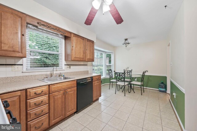 11919 Berrybrook Ter, Upper Marlboro, MD 20772 - kitchen featuring dishwasher, a sink, light tile patterned floors, brown cabinets, and light countertops